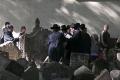 Prayers for a revered rabbi in the Jewish cemetery in Prague.jpg